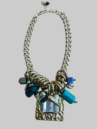 Necklace with chain, charms, and a rectangular pendant on a white background